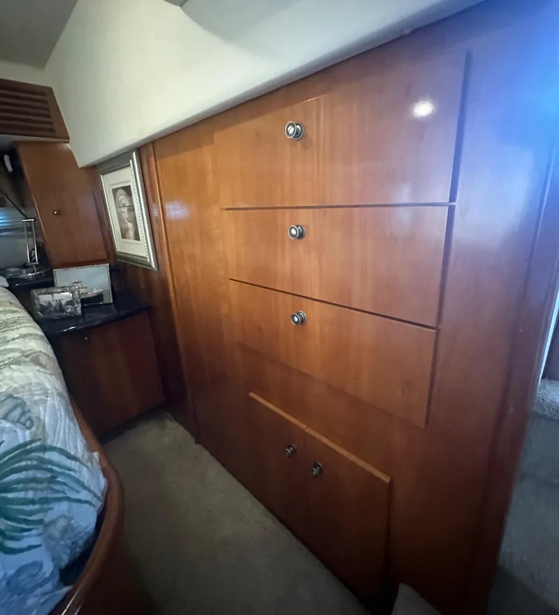 Slide: The Image of Wooden cabinetry in the 2002 Carver 444 Cockpit Motor Yacht bedroom. - 27