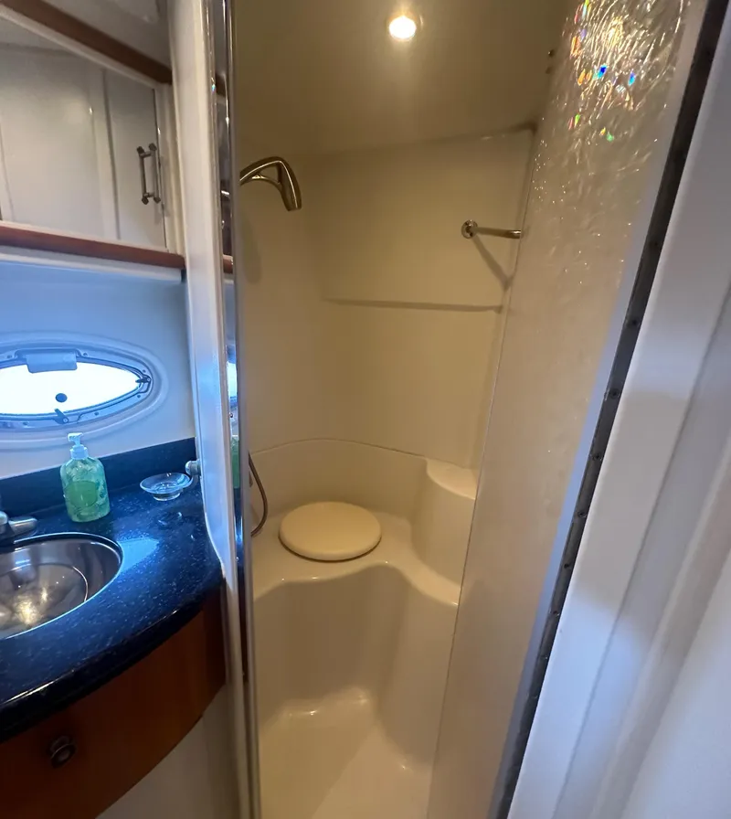 Slide: The Image of 2002 Carver 444 Cockpit Motor Yacht bathroom with shower and sink. - 29