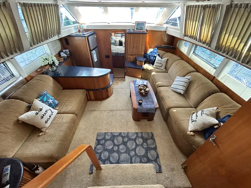 Slide: The Image of Luxurious interior of 2002 Carver 444 Cockpit Motor Yacht with plush seating and modern amenities. - 3