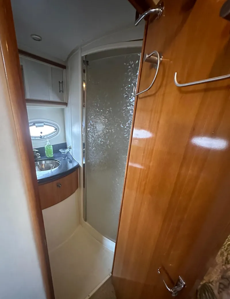 Slide: The Image of 2002 Carver 444 Cockpit Motor Yacht bathroom with shower and sink. - 30