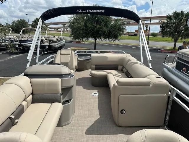Slide: The Image of 2024 Sun Tracker Fishin' Barge 20 DLX pontoon boat with spacious seating and canopy. - 4