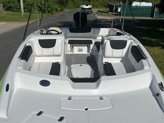 Slide: The Image of 2024 Tahoe 2150 boat interior with seating and storage compartments. - 12