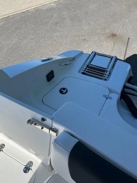 Slide: The Image of 2024 Tahoe 2150 boat stern with swim platform and ladder. - 13