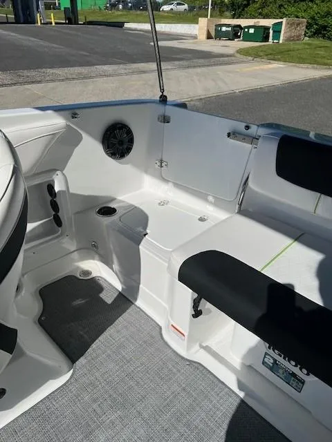 Slide: The Image of 2024 Tahoe 2150 boat interior with seating and speaker system. - 15