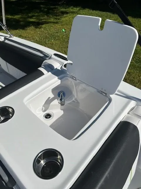 Slide: The Image of 2024 Tahoe 2150 boat sink and cup holders on deck. - 16