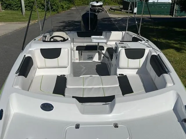 Slide: The Image of 2024 Tahoe 2150 boat interior with seating and steering wheel. - 5