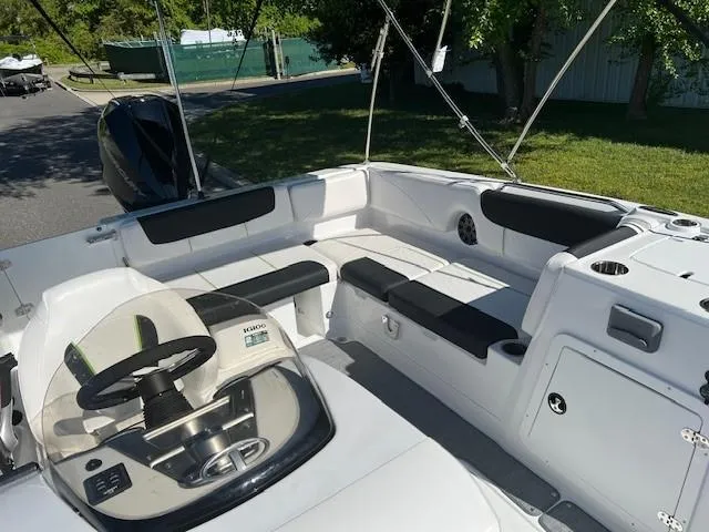 Slide: The Image of 2024 Tahoe 2150 boat interior with seating and steering wheel. - 9