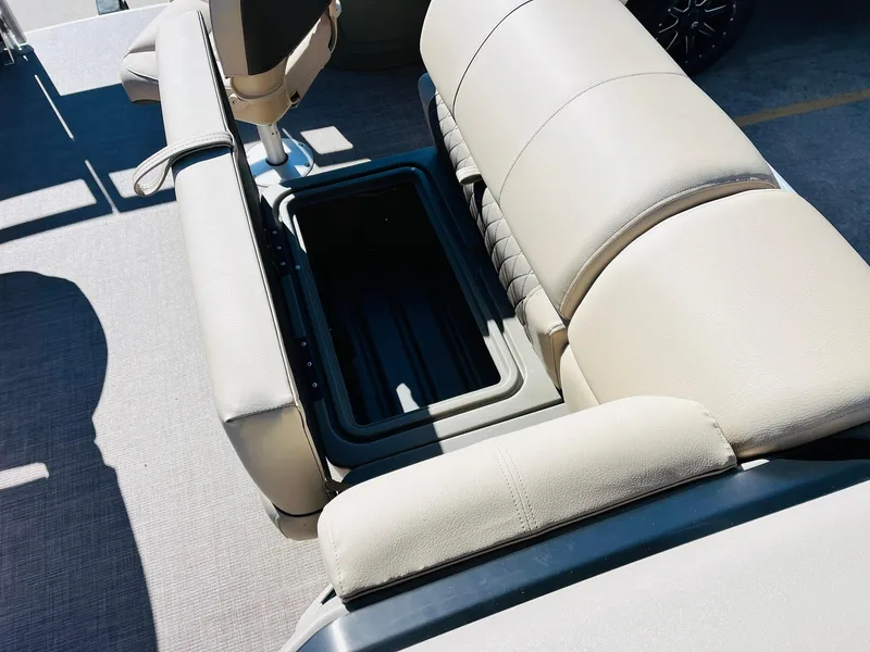 Slide: The Image of 2024 Sun Tracker Fishin' Barge 20 DLX boat seating with storage compartment. - 18