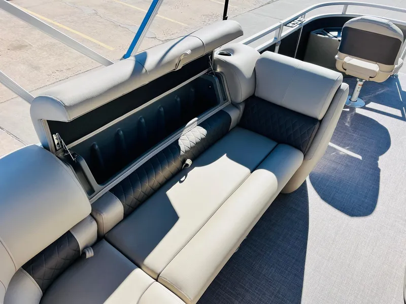 Slide: The Image of 2024 Sun Tracker Fishin' Barge 20 DLX interior seating and storage compartment. - 23