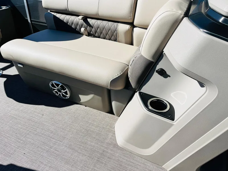 Slide: The Image of 2024 Sun Tracker Fishin' Barge 20 DLX interior seating and cup holder. - 27