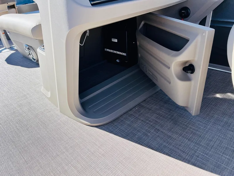 Slide: The Image of Open storage compartment on 2024 Sun Tracker Fishin' Barge 20 DLX boat. - 31