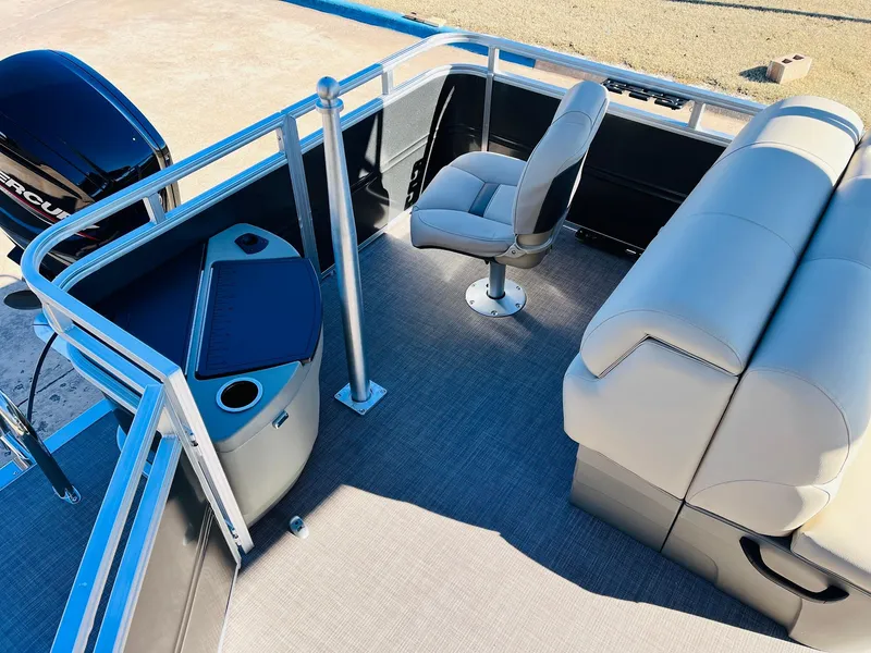 Slide: The Image of 2024 Sun Tracker Fishin' Barge 20 DLX interior with seating and fishing station. - 32