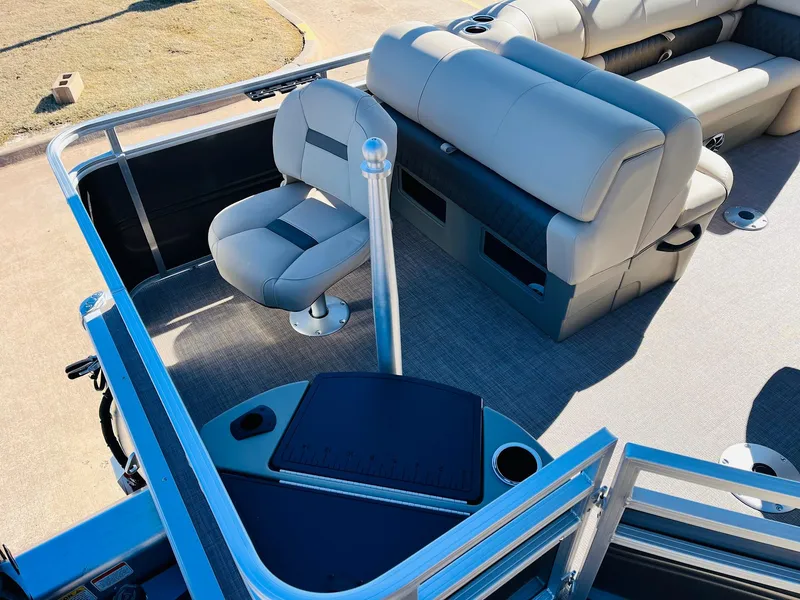 Slide: The Image of 2024 Sun Tracker Fishin' Barge 20 DLX interior with seating and fishing station. - 33