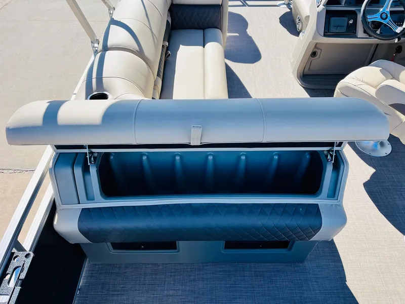 Slide: The Image of 2024 Sun Tracker Fishin' Barge 20 DLX interior seating and storage compartment. - 34