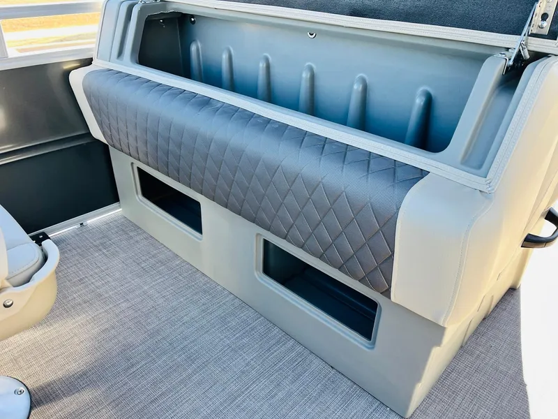 Slide: The Image of 2024 Sun Tracker Fishin' Barge 20 DLX interior seating and storage compartments. - 35