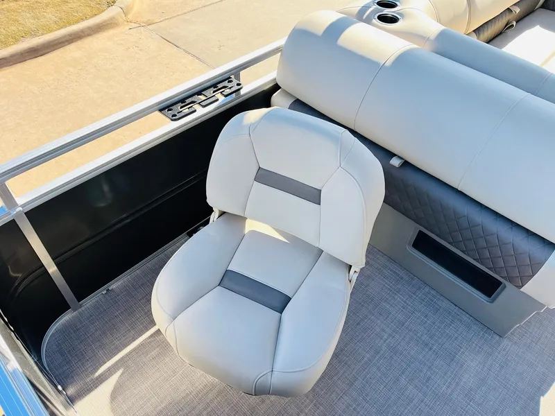 Slide: The Image of 2024 Sun Tracker Fishin' Barge 20 DLX boat interior with cushioned seating. - 36