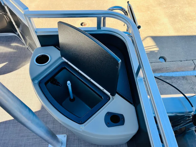 Slide: The Image of 2024 Sun Tracker Fishin' Barge 20 DLX boat with open storage compartment. - 38