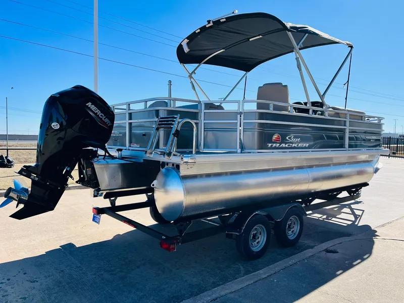 Slide: The Image of 2024 Sun Tracker Fishin' Barge 20 DLX pontoon boat with Mercury outboard motor. - 4