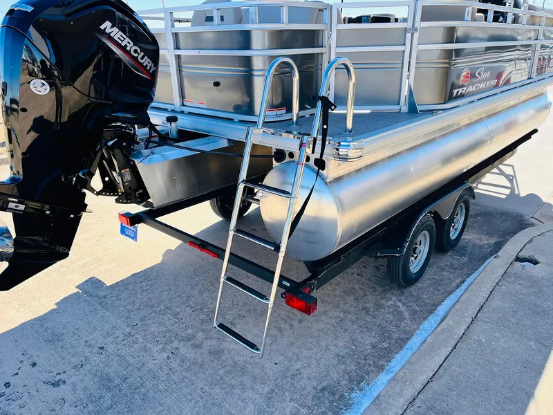 Slide: The Image of 2024 Sun Tracker Fishin' Barge 20 DLX pontoon boat with Mercury outboard engine. - 7