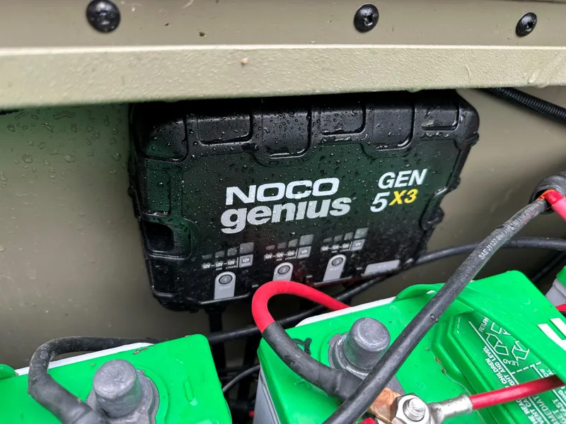 Slide: The Image of NOCO Genius GEN 5X3 charger in 2024 Tracker Grizzly 2072 CC Sportsman Kicker boat. - 2