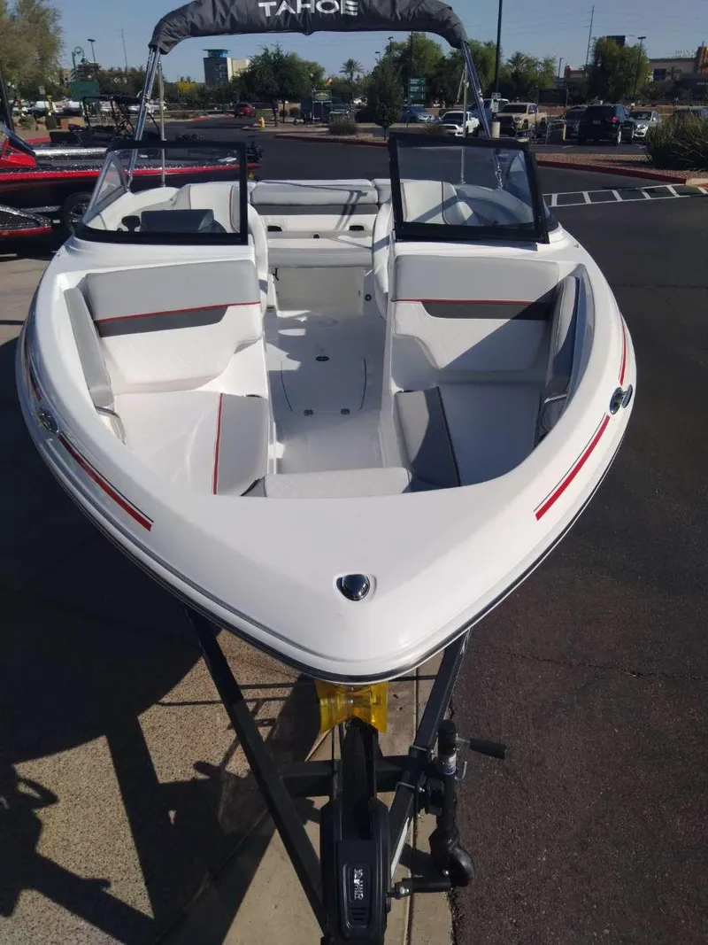 Slide: The Image of 2024 Tahoe 210 Si boat with white and red accents on display. - 3