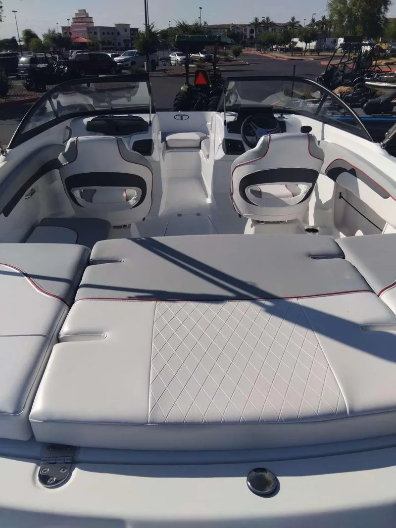 Slide: The Image of 2024 Tahoe 210 Si boat interior with white seating and modern design. - 4