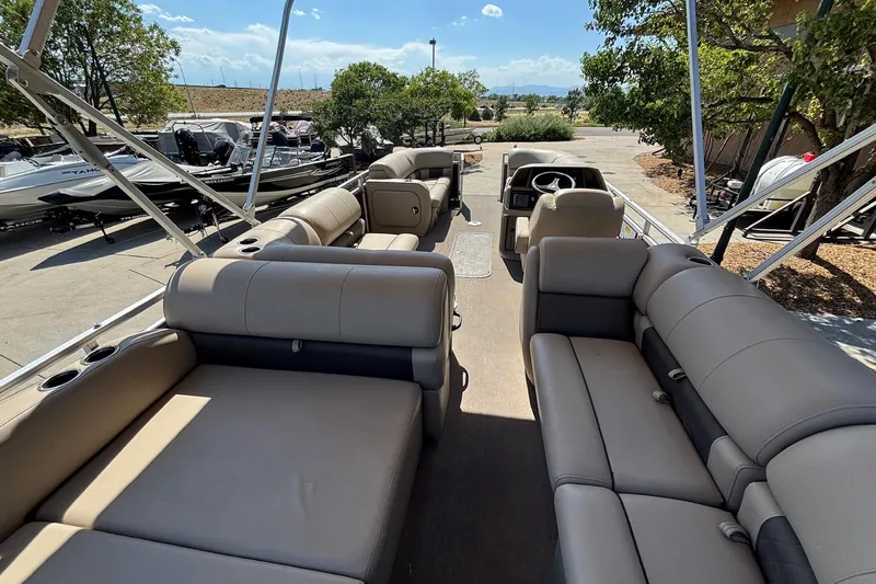 Slide: The Image of 2024 Sun Tracker Party Barge 22 RF XP3 interior with spacious seating and helm. - 6