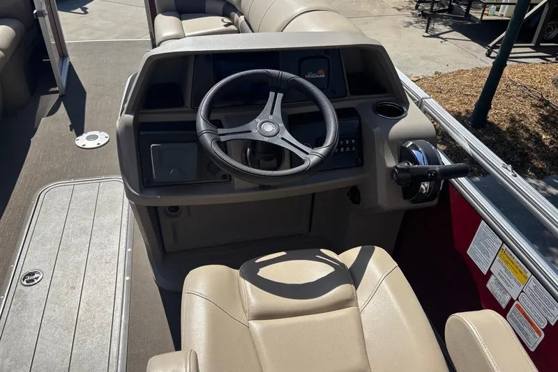 Slide: The Image of 2024 Sun Tracker Party Barge 22 RF XP3 helm with steering wheel and controls. - 8
