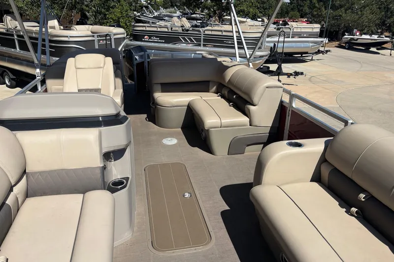 Slide: The Image of 2024 Sun Tracker Party Barge 22 RF XP3 interior with spacious seating and cup holders. - 3
