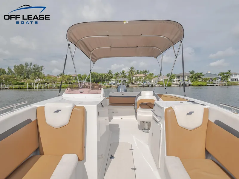 Slide: The Image of 2021 Starcraft SVX 231 OB boat interior with tan seating and canopy. - 9