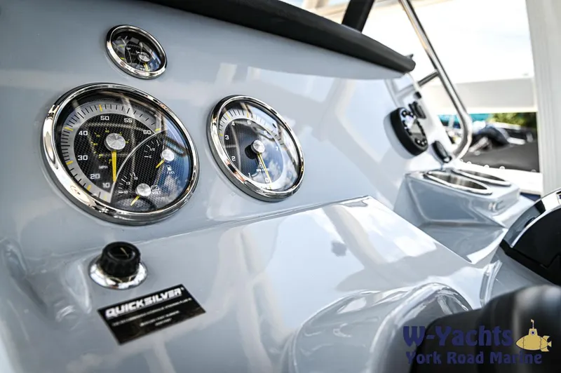 Slide: The Image of Close-up of 2024 Bayliner Trophy T22CC dashboard with gauges and controls. - 14