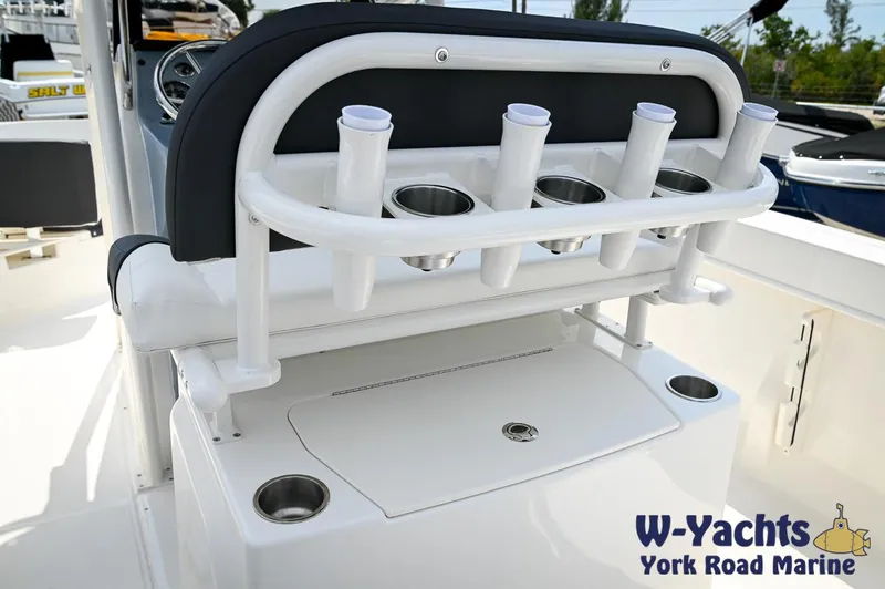 Slide: The Image of 2024 Bayliner Trophy T22CC boat interior with rod holders and cup holders. - 20
