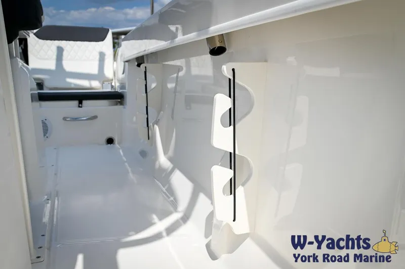 Slide: The Image of 2024 Bayliner Trophy T22CC boat interior with rod holders, W-Yachts York Road Marine. - 28