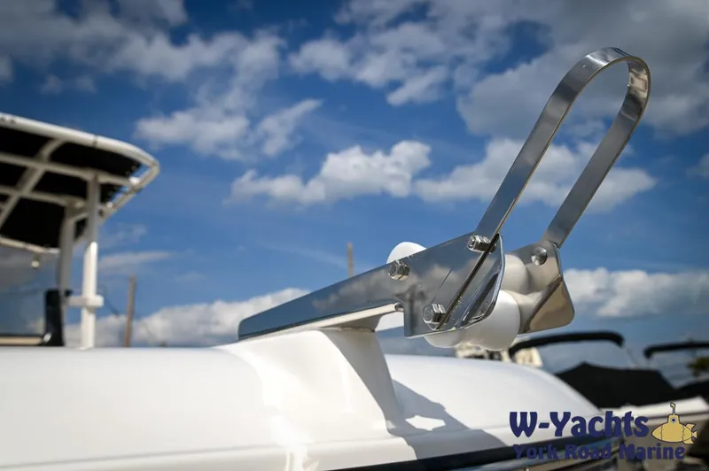 Slide: The Image of 2024 Bayliner Trophy T22CC boat detail with anchor holder against blue sky. - 3