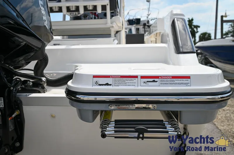 Slide: The Image of 2024 Bayliner Trophy T22CC boat stern with swim platform and ladder. - 30
