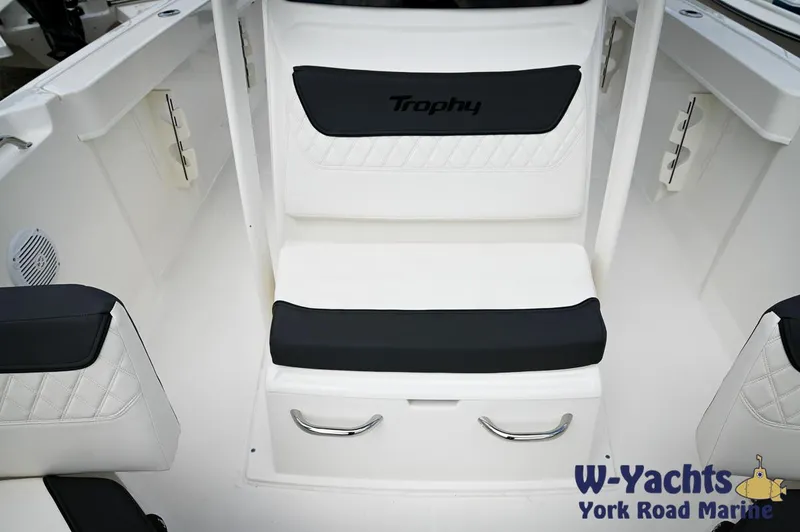Slide: The Image of 2024 Bayliner Trophy T22CC boat seating area with storage, showcased by W-Yachts York Road Marine. - 8