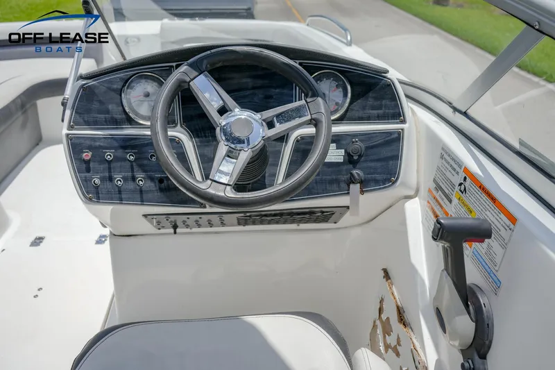 Slide: The Image of 2020 Hurricane 217 SD boat dashboard and steering wheel, Off Lease Boats. - 11