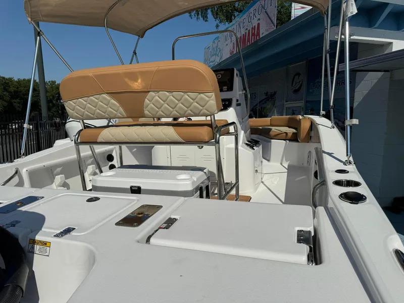 Slide: The Image of 2024 NauticStar 191 Hybrid boat interior with tan and white seating. - 10
