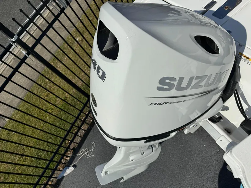 Slide: The Image of 2024 NauticStar 191 Hybrid with Suzuki outboard motor. - 13