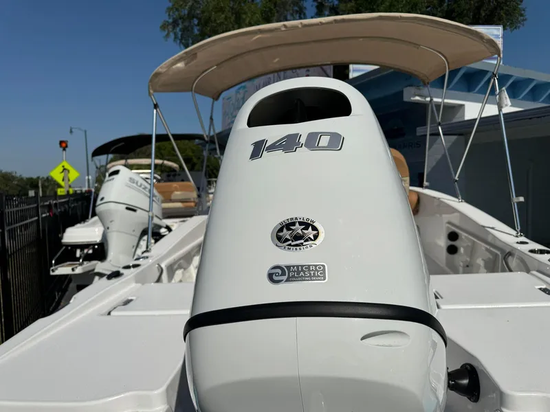 Slide: The Image of 2024 NauticStar 191 Hybrid boat with 140 HP engine, rear view. - 14