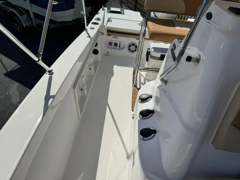 Slide: The Image of 2024 NauticStar 191 Hybrid boat interior with seating and control panel. - 5