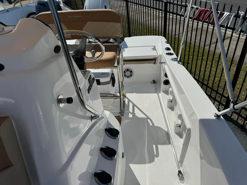 Slide: The Image of 2024 NauticStar 191 Hybrid boat interior with seating and steering console. - 6