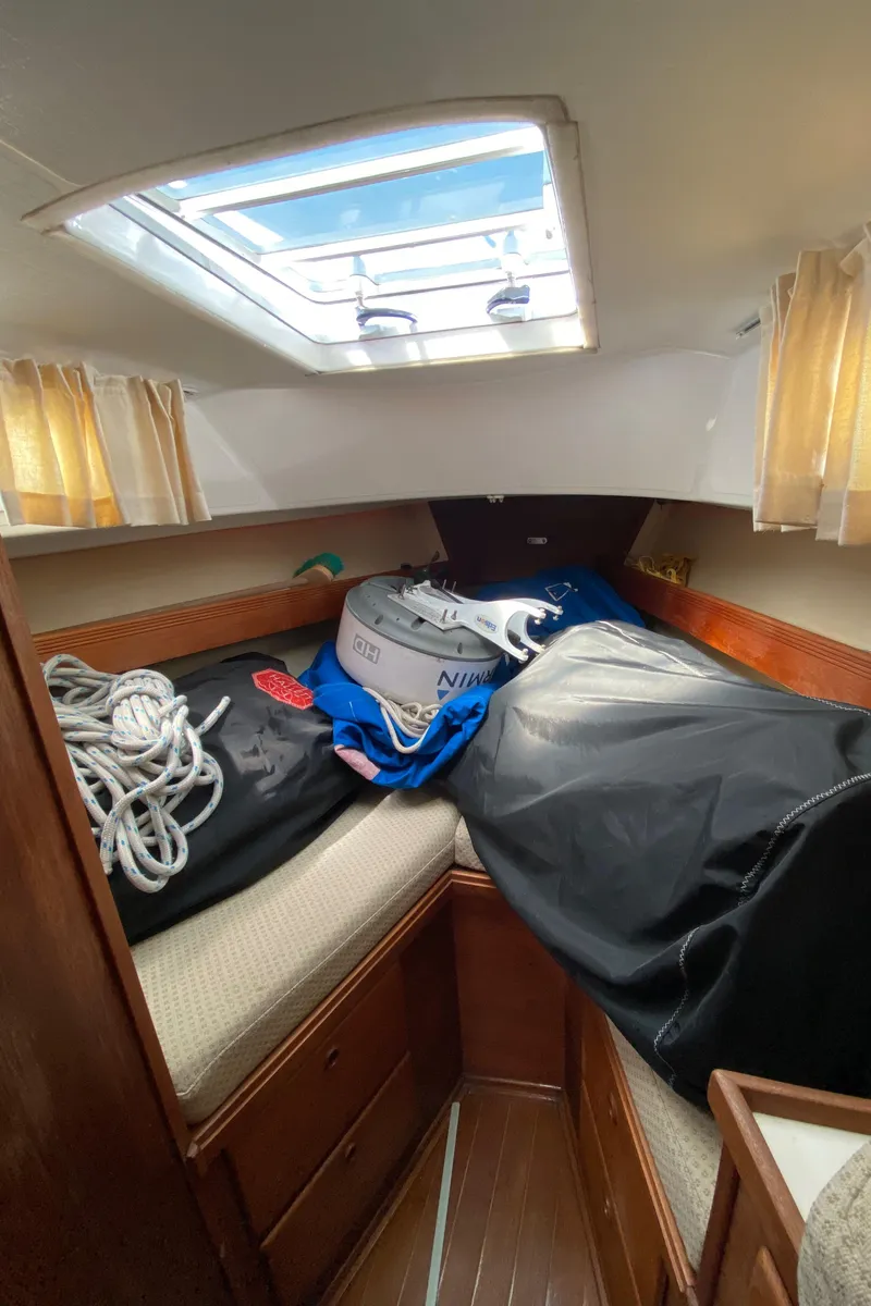 Slide: The Image of Interior cabin of a 1985 Sabre 32 sailboat with storage items. - 19