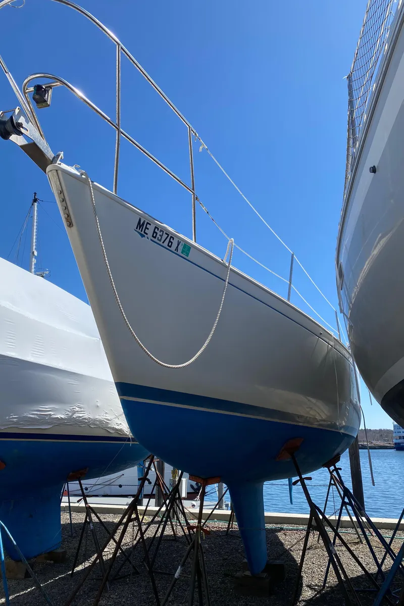 Slide: The Image of 1985 Sabre 32 sailboat on stands in a marina. - 3