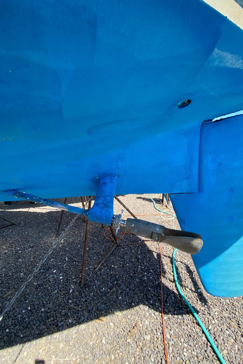 Slide: The Image of 1985 Sabre 32 sailboat hull and rudder in dry dock. - 6