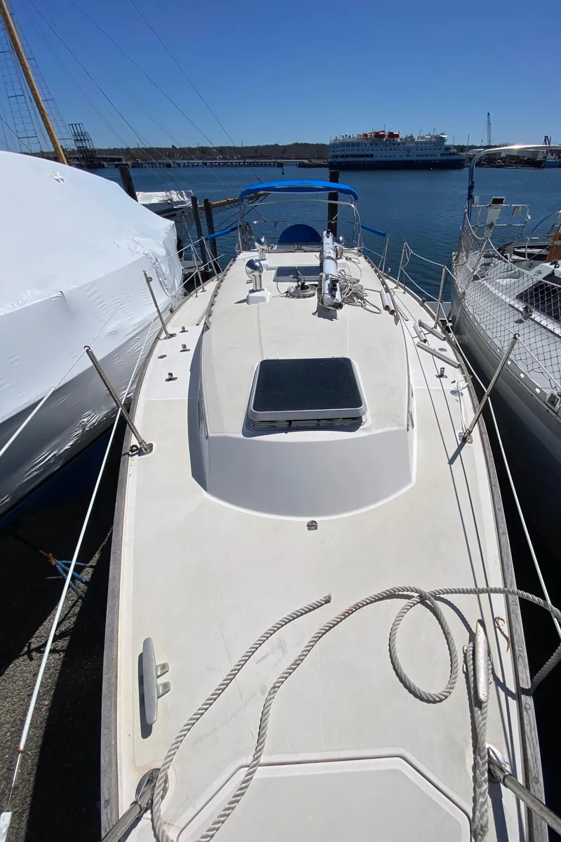 Slide: The Image of 1985 Sabre 32 sailboat docked at a marina. - 9