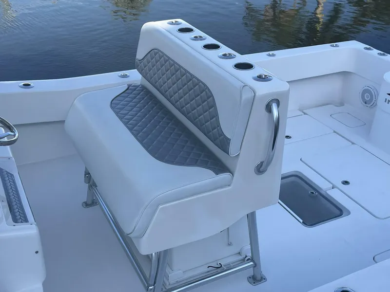 Slide: The Image of 2016 Invincible 36 CC boat with cushioned seating and rod holders. - 10