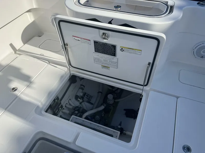 Slide: The Image of Open hatch on a 2016 Invincible 36 CC boat showing internal components. - 15