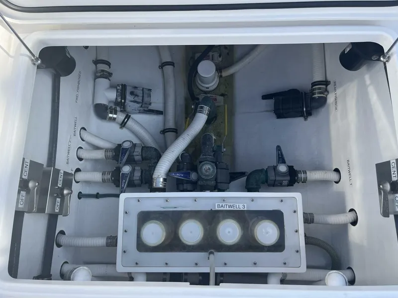 Slide: The Image of 2016 Invincible 36 CC boat plumbing system with baitwell and hoses. - 16