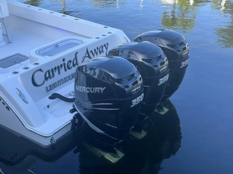 Slide: The Image of 2016 Invincible 36 CC boat with triple Mercury 350 outboard engines. - 17